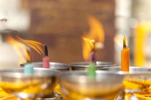 Oil lamps lit by believers as a symbol of the light of wisdom (the light dispels darkness and