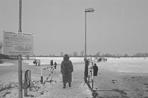 Ferry dock, people walk across ice rink, frozen Elbe, Bleckede, Lower Saxony, Germany, February 9,
