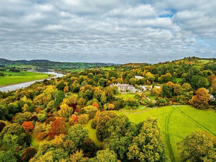 Autumn colours over Bodnant House and Garden from a drone, Conwy River, Colwyn Bay, Conwy, Wales,