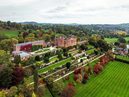 Autumn colours over Powis Castle and Garden from drone, Welshpool, Powys, Wales, England, United