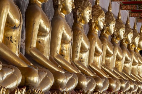 Gilded Buddha statues (Bhumispara mudra: Buddha Gautama at the moment of enlightenment), Wat Suthat