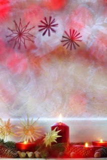 Christmassy decorated iced window, candle light, straw stars, Germany