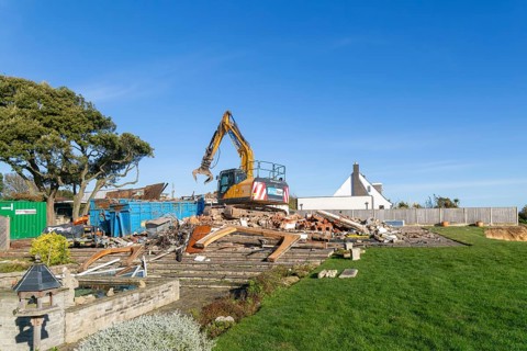 Demolition of Jean Flick's house, The Warren, Thorpeness, Suffolk, England, UK due to rapid coastal