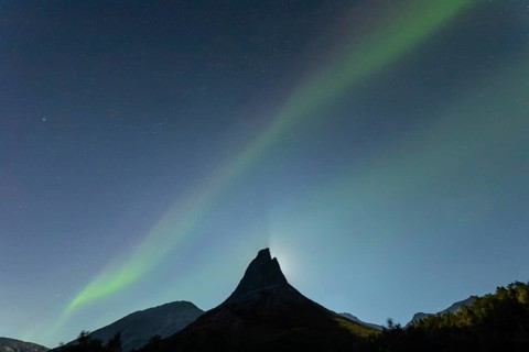 National mountain of Norway - Stetind in the Nordland under auroras and a full moon