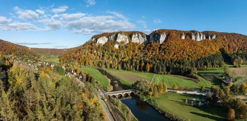 Aerial view, panorama of the Upper Danube Valley, surrounded by autumn vegetation with the