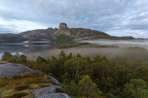 Magical morning fog on Steigtindvatnet in front of the majestic Steigtinden in Norway near Bodø