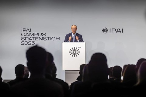 Federal Chancellor Friedrich Merz (CDU) . Portrait at the lectern with free text space.