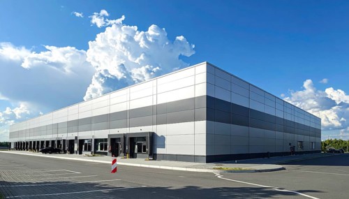 Modern supermarket building exterior against blue sky, Inviting white facade, some clouds, concept