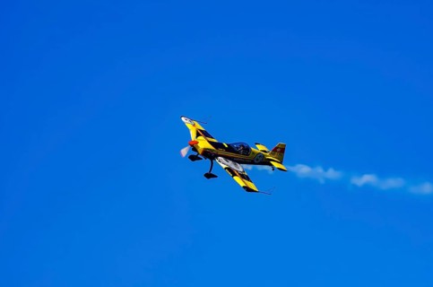 A Votec 351 sport aircraft from the Swiss MSW Aviation AG with registration HB-YMV during a flight