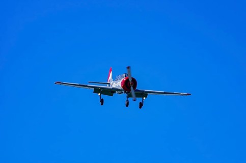 A Jakovlev Jak-52 with registration LY-HLZ during a flight demonstration as part of an air show on