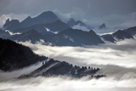 View from the Nebelhorn summit to mountains of the Allgäu Alps, mountains rising from fog in the