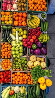Fresh fruits and vegetables in a market display, aerial view perpendicular top down, healthy eating