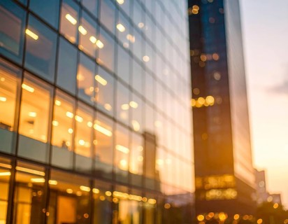 Modern building reflecting sunset light at dusk. Abstract Futuristic Business Background, AI