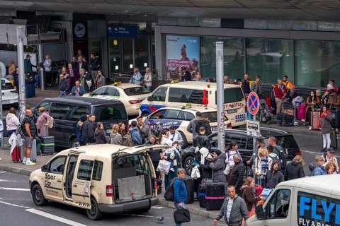 Ahead of Terminal B, many thousands of people set off on holiday on the first day of the North