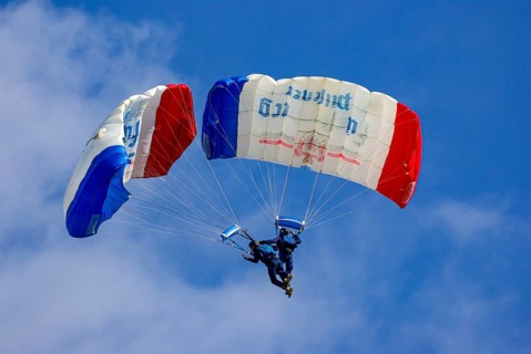 Two parachutists during an aerial acrobatic performance as part of an air show at the Rossfeld in