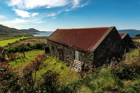 Stone farm buildings with rusty corrugated iron roof, Ring of Kerry, Iveragh Peninsula, County