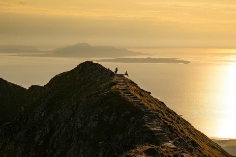Hikers on the Rørsethornet stone staircase, with 3292 steps one of the longest continuous stone
