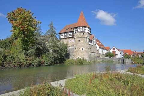 Zollern Castle built around 1255 with water tower on the Eybach stream, half-timbered house,