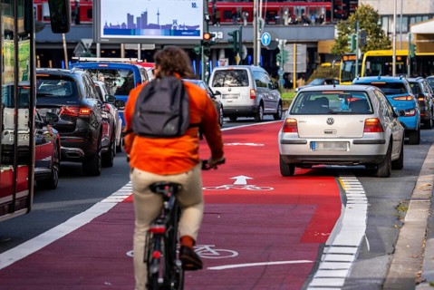 Cycle path, cycle lane, marked in red to draw the attention of motorists to the cycle path, between