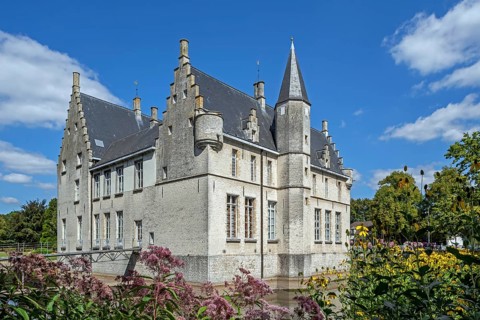 Kasteel Cortewalle, 15th century moated castle in Flemish Renaissance style at Beveren in summer,