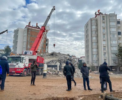 Turkish civil defense teams (AFAD) search for survivors under the rubble after a powerful 7