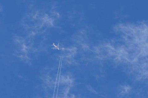Two airliners Airbus A380 jet passenger aircraft of Emirates airlines and a Boeing 737 of Norweign