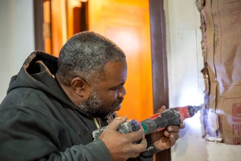 Detroit, Michigan - Workers remodel a house in the Morningside neighborhood that had been vacant