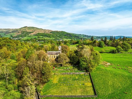 Holy Trinity Church from a drone, Bog Lane, Brathay village, Lake District, Cumbria, England,