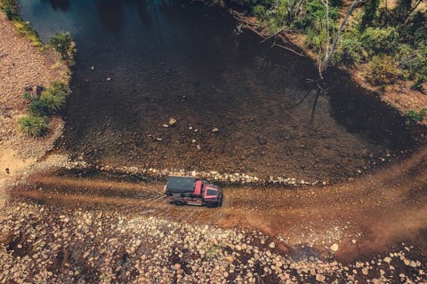 Landrover crosses river in Australian outback in the Kimberley, North West Australia, Australia