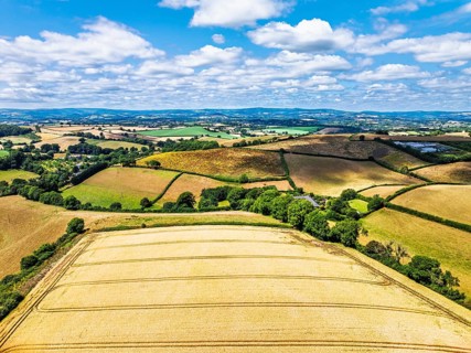 DefaultFarms and Fields over Torquay from a drone, Devon, England, United Kingdom