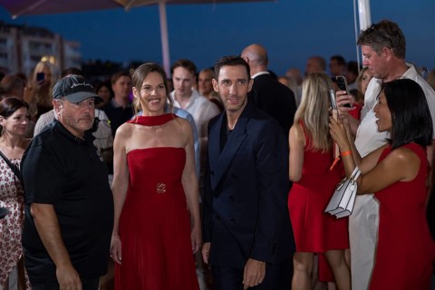 Hilary Swank and Marcel Remus walk through the crowd at the Remus Lifestyle Night on the rooftop