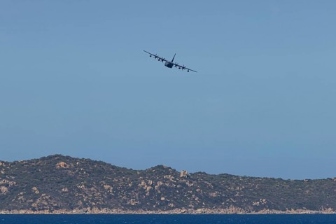 A Lockheed Martin MC-130J Commando II, a US Air Force military aircraft, flies low over Costa Rei,