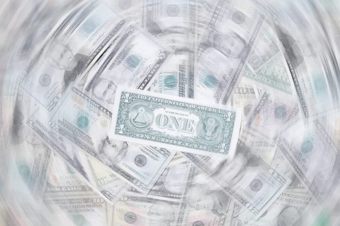 Various US dollar notes in a pile, banknotes