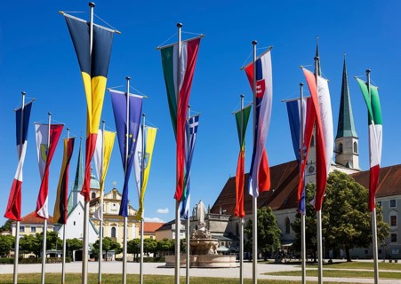 National flags at Kapellplatz with the collegiate parish church of St Philip and St James, place of
