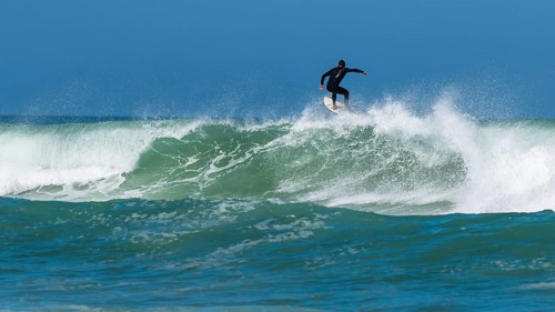 Surfer riding a wave on Contis beach, Saint Julien en Born, Saint-Julien-en-Born, Landes, France