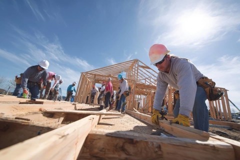Collage of construction workers building homes, AI generated