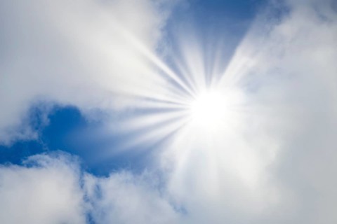 Symbolic image, global warming, heat, bright sunshine penetrates thin clouds and illuminates the