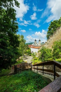 Small park with seating, a playground and a fountain at the entrance to Trencin Castle, Capital of