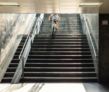 A cyclist descends a staircase on a mountain bike, Capital of Culture 2026, Trencín, Slovakia