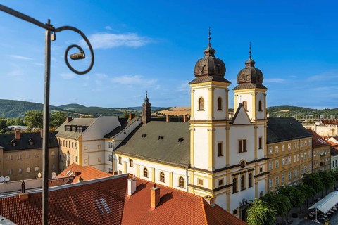 View from the city tower of the Piarist Church of St Francis Xavier and the old town in the evening