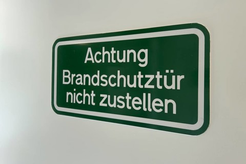 Safety notice on fire door with the inscription Do not close the fire door, Germany
