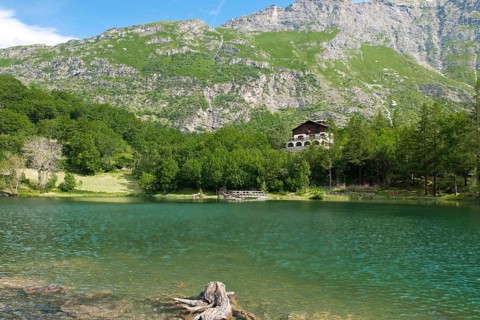 View of mountain lake Lago Grande near Moncenisio in Val Cenischia in the Graian Alps, behind it