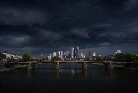 A storm passes over the Frankfurt banking skyline with gloomy clouds, Frankfurt am Main, Hesse,