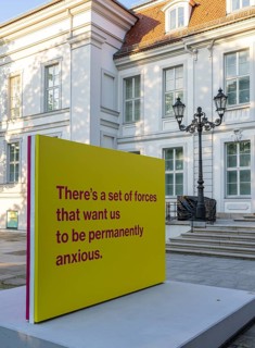 Tony Cokes, visual artist and educator, display panel at the Palais Populaire Unter den Linden,