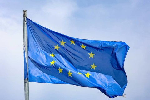 Düsseldorf, North Rhine-Westphalia, Germany - European flag fluttering in the wind on the flagpole,