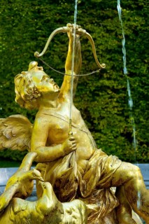 Fountain figure of Cupid, god of love, in gold with bow and arrow, Rococo style, east parterre,