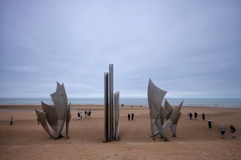 Tourists, visitors on the beach, Les Braves, memorial of Anilore Banon, polynational memorial to