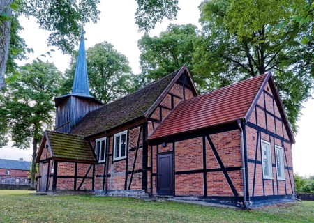 Prorep village church, a half-timbered church with a wooden tower, in the village centre. Porep is