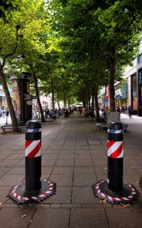 Automatic, electrically retractable bollards to protect against terrorist attacks, pedestrian zone,