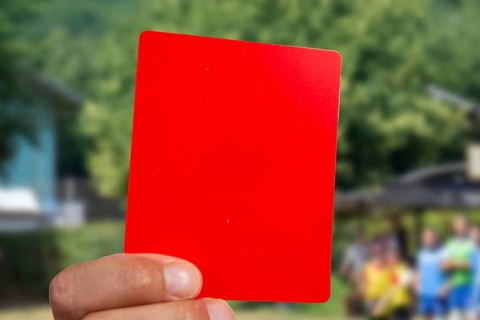 (Photomontage) Red card at a football match